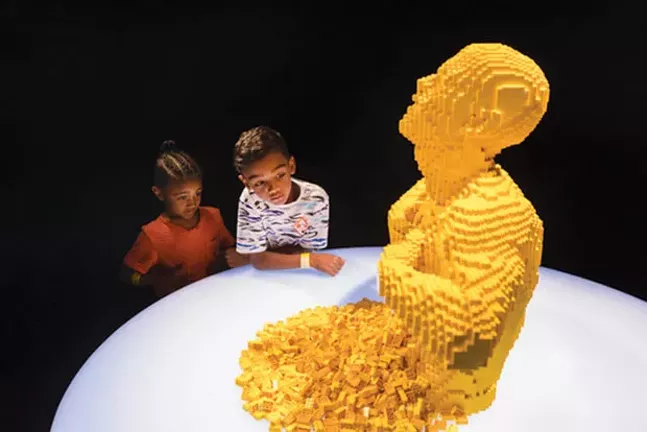 Children marvel at “Yellow,” a Lego sculpture by Nathan Sawaya, at The Art of the Brick at the Carnegie Science Center’s new PPG Science Pavilion - PHOTO COURTESY OF RENEE ROSENSTEEL