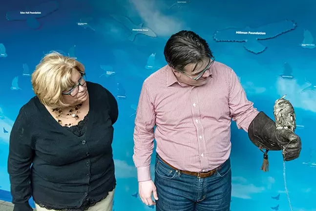 Editor Rob Rossi and his mother mingled with his flighty former foes in March, when the National Aviary named a barred owl “Rossi” in his honor. - PHOTO COURTESY OF NATIONAL AVIARY