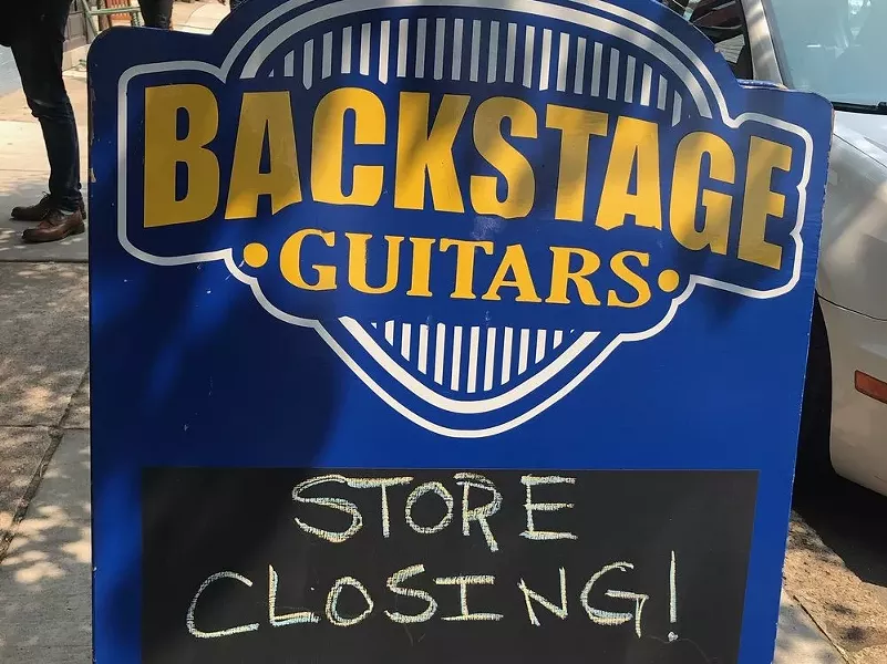 Sign in front of Backstage Guitars - JASON COOK