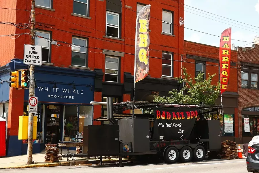Bad Azz BBQ booth setting up for Little Italy Days - CP PHOTO: JARED WICKERHAM