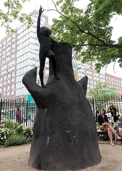 Rudy Shepherd (costumed) performs atop an earlier version of his sculpture "Black Rock Negative Energy Absorber," in New York City. - PHOTO COURTESY OF E.F. ROSSARD