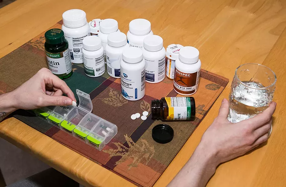 Stefanie takes more than 10 different vitamins and supplements daily. - CP PHOTO BY JOHN COLOMBO