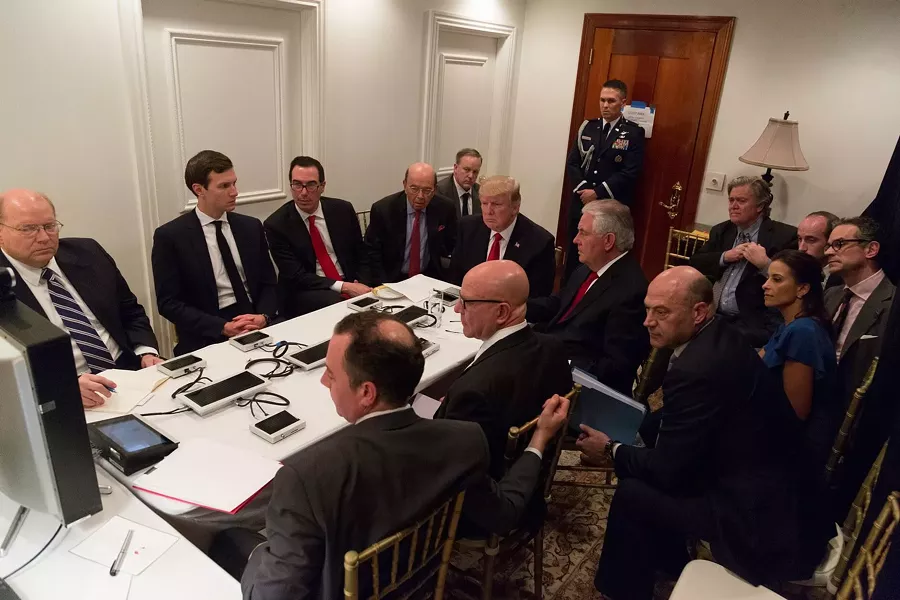 President Donald Trump receives a briefing on a military strike on Syria from his National Security team on April 6. - WHITE HOUSE PHOTO