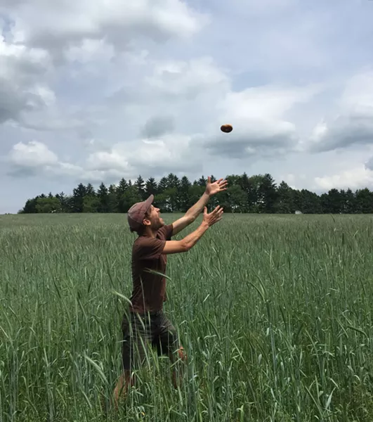 Justin Lubecki catching a bagel in the high grass - PHOTO COURTESY OF ANNE DEFAZIO