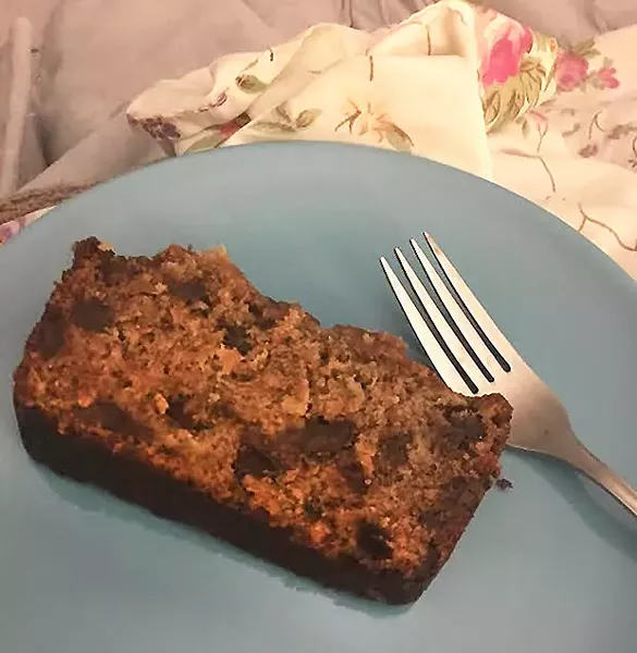 Author eating banana bread in bed - PHOTO COURTESY OF KELLY ANDREWS