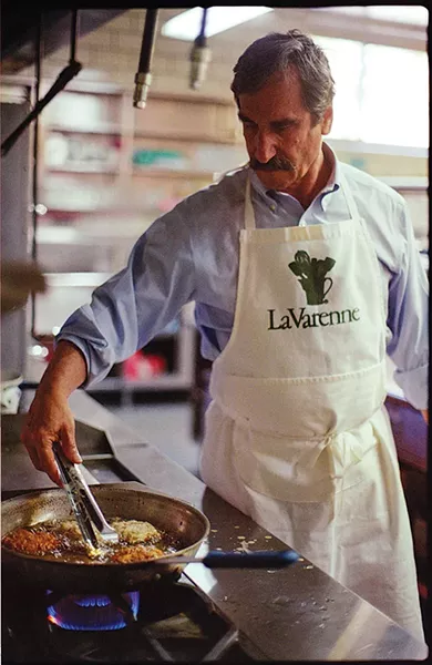 Drew Barkley of Temple Sinai makes his homemade latkes - PHOTO BY KATE HAGERTY