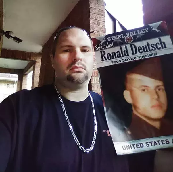 Jason Deutsch holds up a photo of his late father. - PHOTO COURTESY OF JASON DEUTSCH
