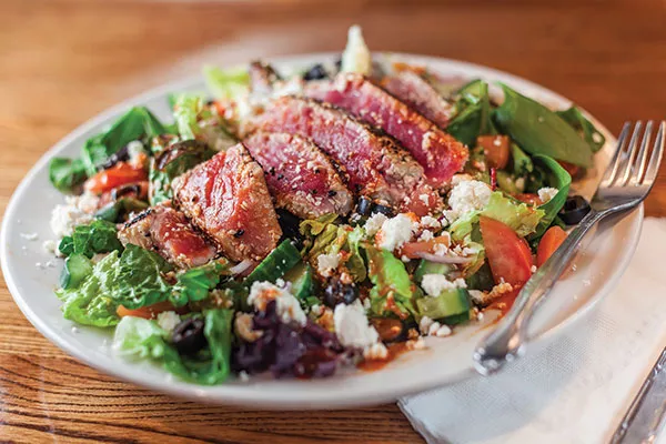 Ahi tuna salad: Sesame-crusted seared tuna with a spicy teriyaki drizzle and feta cheese - PHOTO BY VANESSA SONG
