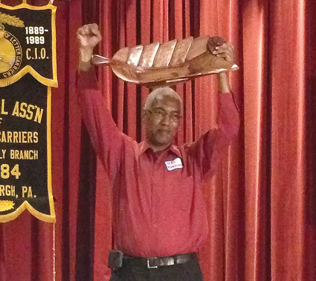 Carl Redwood receiving the Thomas Merton Center New Person Award in June - CP PHOTO BY RYAN DETO