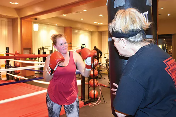 Gloria Sztukowski (right) trains with a new member. - CP PHOTO BY JAKE MYSLIWCYZK