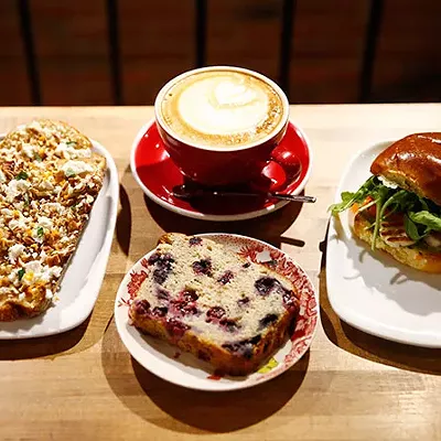 Chevre and fig jam toast, a latte, blueberry banana bread, and halloumi from De Fer Coffee & Tea