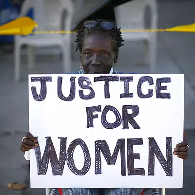 Vanetta Olds protests the alleged assault of two Black women customers at the Exxon Mobile gas station near Marshall-Shadeland on Thu., Sept. 26.
