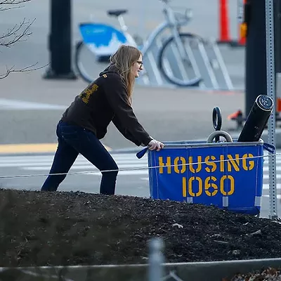 A University of Pittsburgh students pushes a housing cart with their belongings as students move off campus last week in Oakland.