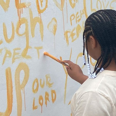 Artists, community volunteers begin painting city's largest mural
