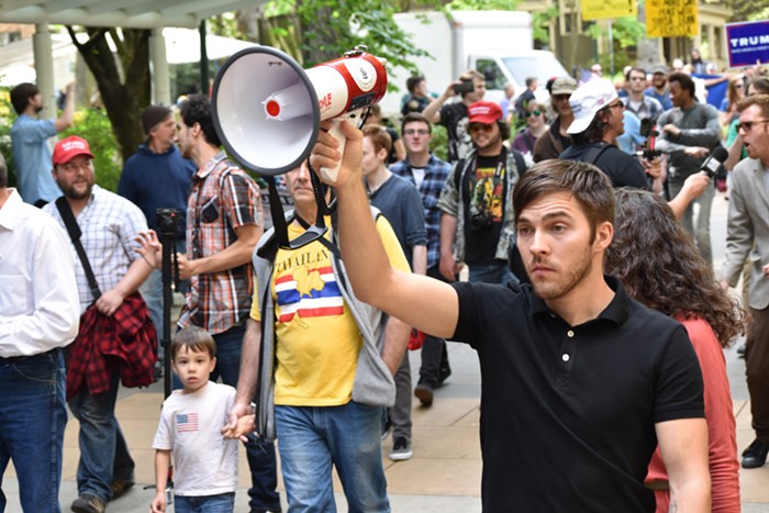 This anti-Trump protester used his megaphones siren function for a while...