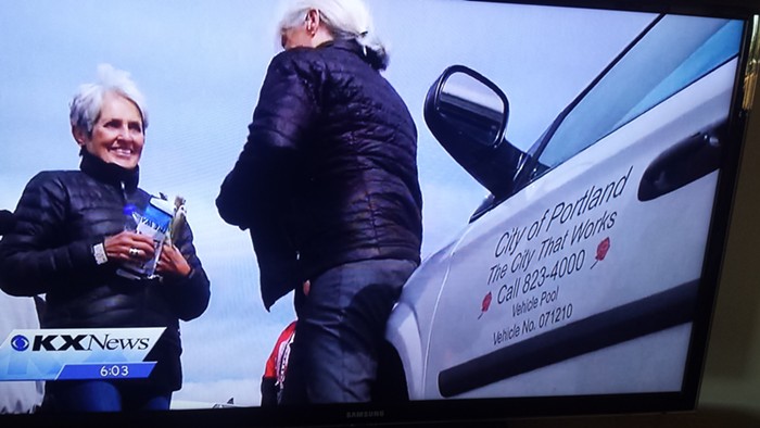 A photo, attached to a complaint to the city, showing Patricia Davis Gibson in North Dakota with a city vehicle.