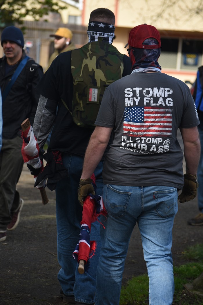 Police made those with large wooden flag poles put them back in their cars. This is a Trump supporters confederate flag.