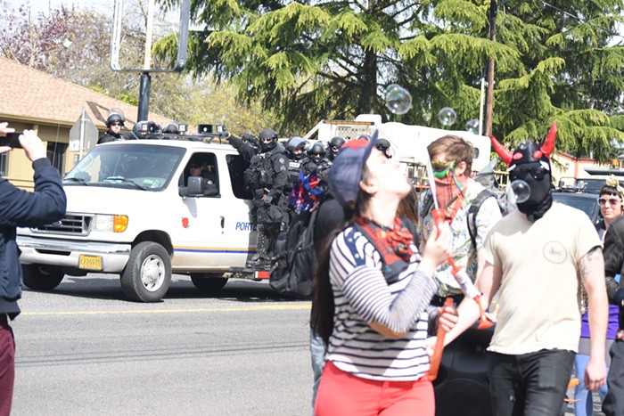 Riot cops followed the march closely and tried to separate the groups