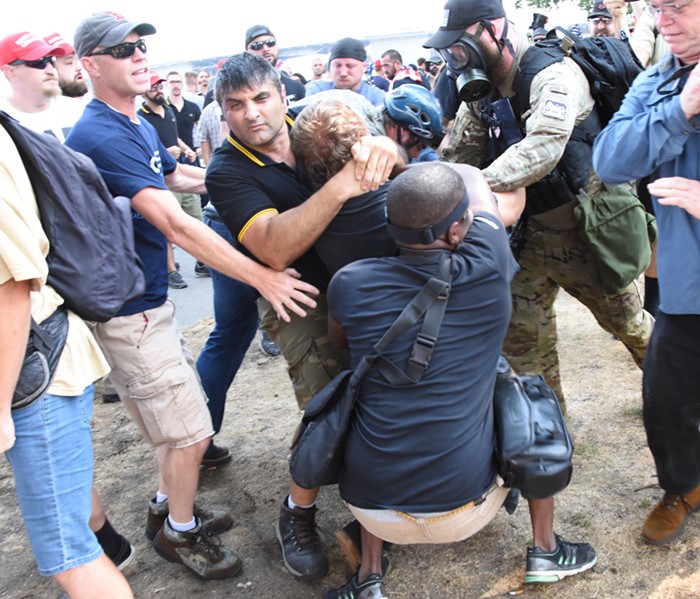 An alt-right Proud Boys member slams a left-wing protester to the ground