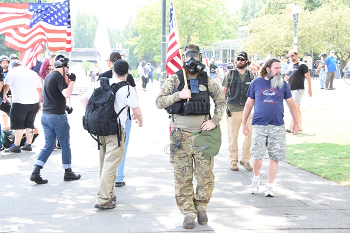 A few Three Percenters put on gas masks