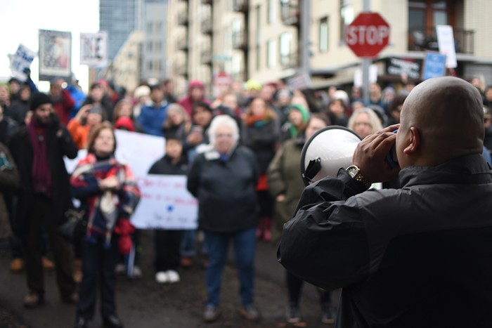 Immigrant-rights organizer Juan Rogel speaks at an anti-ICE rally in March