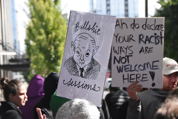 Strong signs in the Pearl District, as demonstrators protest Jeff Sessions immigration jeremiad.