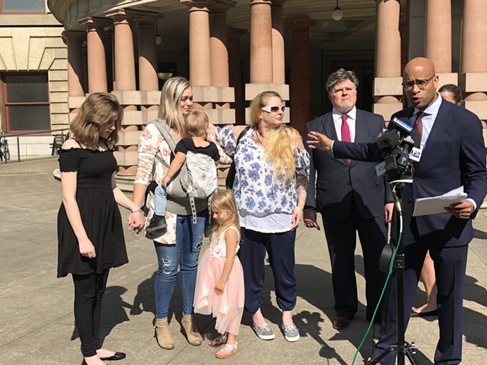 Attorney Andrew Stroth points to his client, Barbara Elifritz at a Monday press conference. Elifritz was joined by her two daughters and grandchildren.