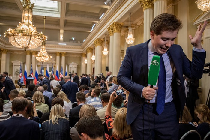 HELSINKI SUMMIT: We all know who was there. Id rather use a photo of this member of the Russian press speaking into a technologically advanced cucumber.