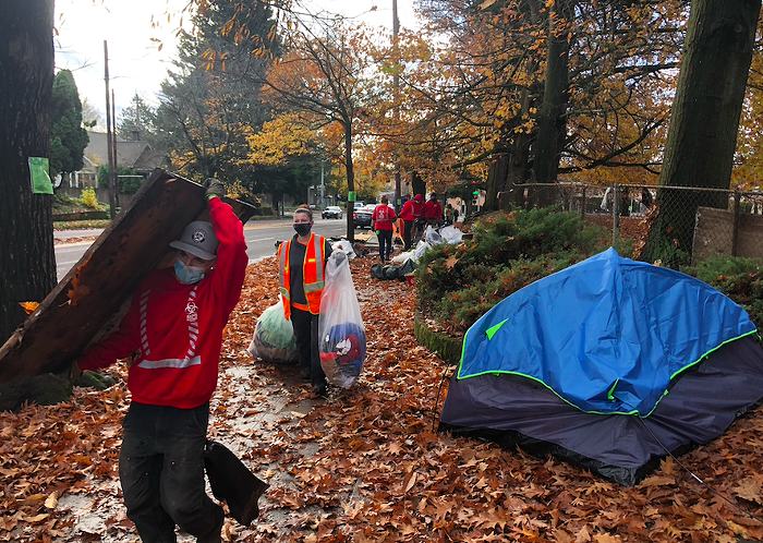 Rapid Response staff remove trash and belongings from the SE Oak encampment.