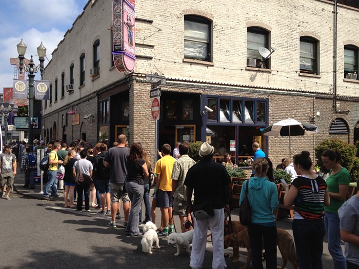 Ye Olden Days of Portland Tourism: A line well over one hundred strong snakes out of downtowns Voodoo Doughnuts, circa 2012.