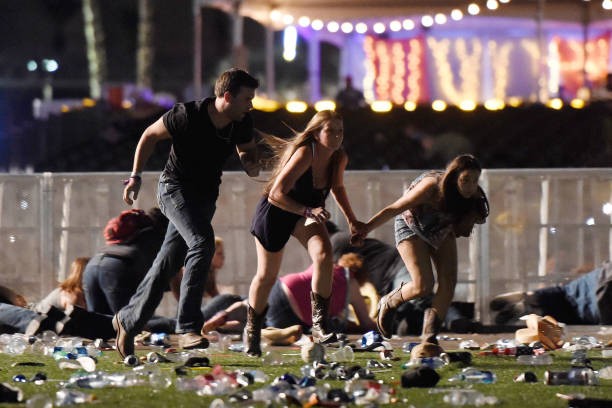 Concert-goers flee from a mass shooting in Las Vegas.