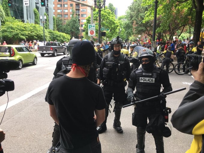 Police block anti-fascist protesters on June 4, 2017.