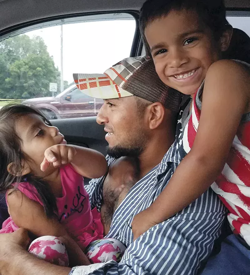 Alex Garcia with his two youngest children. - COURTESY OF ALEX GARCIA