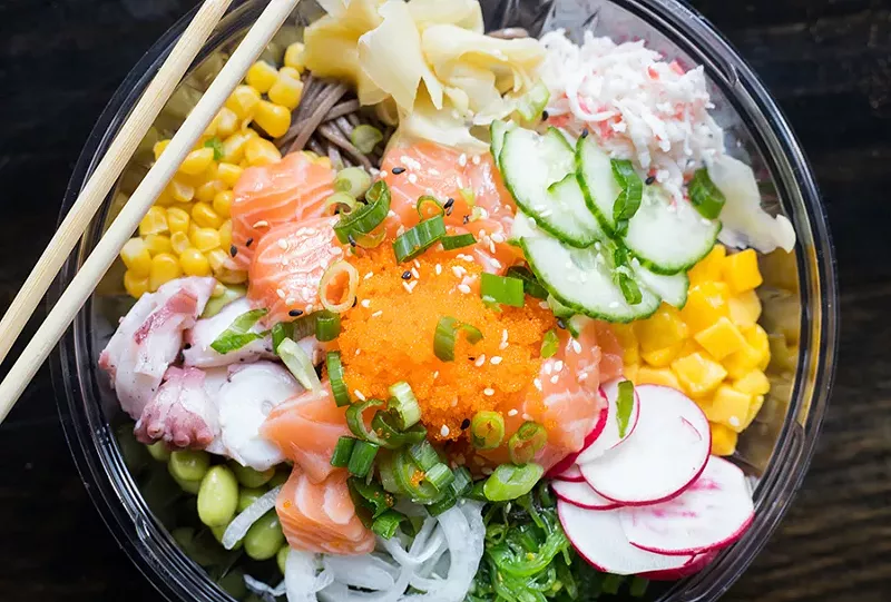 Soba noodles prove an alternative to rice. They're shown here topped with salmon, octopus, corn, ginger, mango, seaweed salad, onion, edamame and crab meat. - MABEL SUEN