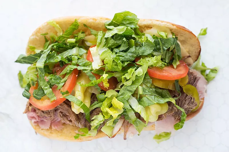 "Anthony's Pride": ham, roast beef, shredded lettuce, tomato, pickle and pepperoncini on cheesy garlic bread. - MABEL SUEN
