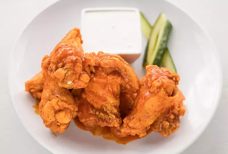 Mango-habanero chicken wings are served with Danish bleu dip. - MABEL SUEN