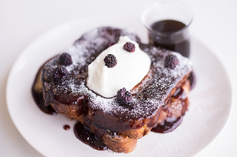 Brioche French toast is topped with custard batter, warm jam and creme fraiche. - MABEL SUEN