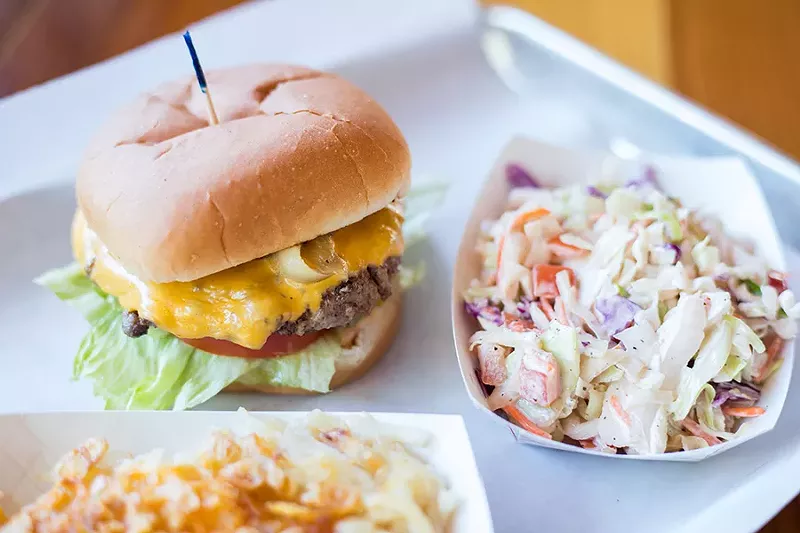 The house-blend burger is topped with Provel, grilled onion and Honey Pit's secret sauce. - MABEL SUEN