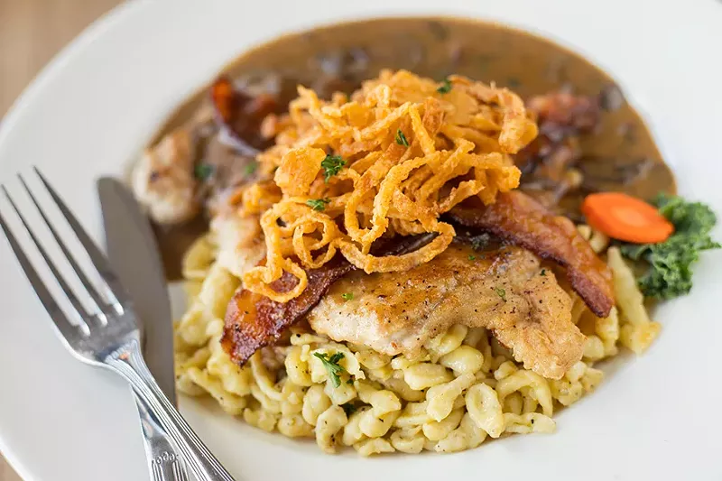 Jägerschnitzel is served with spätzle and cranberries. - MABEL SUEN