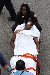 Williams, handcuffed to a stretcher - PHOTO BY NICHOLAS PHILLIPS