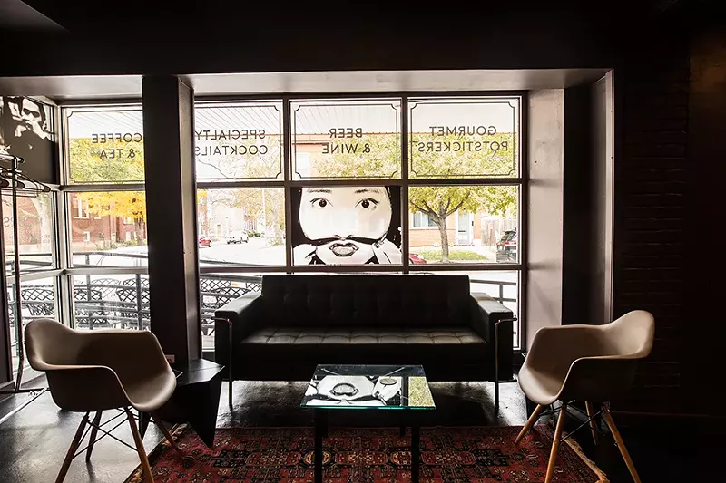 A couch beckons customers from the street. - MABEL SUEN