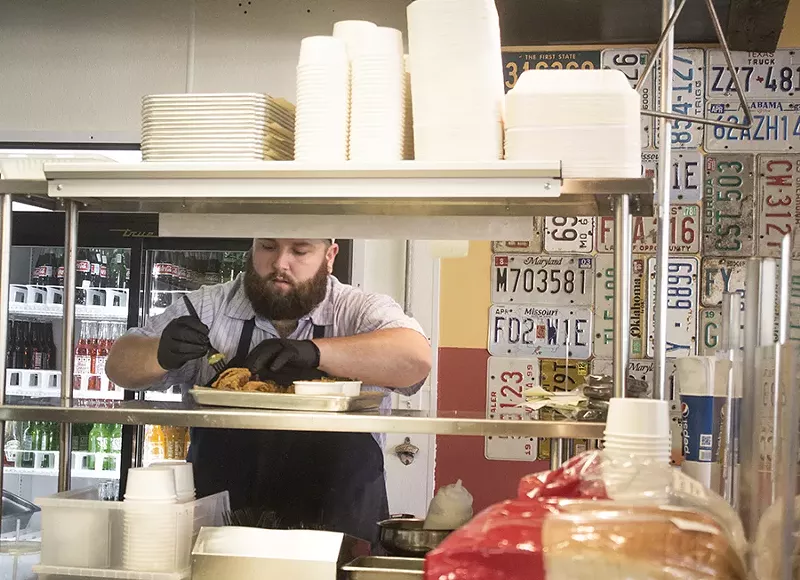 Chef Rick Lewis in the kitchen. - MABEL SUEN