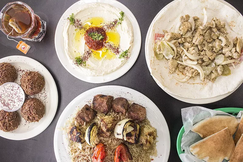 A selection of items from Worldwide International Market: hummus, chicken shawarma sandwich, falafel and combo plate. - PHOTO BY MABEL SUEN
