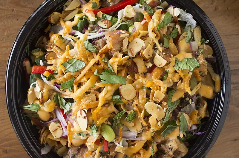 The "Chopstix" bowl with teriyaki chicken, edamame, red onion, bell peppers, toasted almonds, cilantro, basil, crispy wontons, sesame-soy vinaigrette and volcano sauce. - PHOTO BY MABEL SUEN