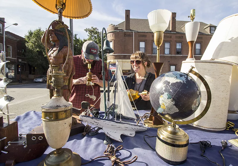 Sam Coffey and Nicole Casper check out an open-air market on Cherokee. - PHOTO BY MABEL SUEN