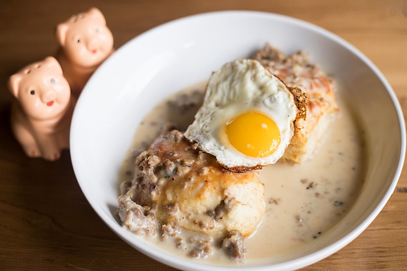 Housemade buttermilk biscuits is topped with housemade sausage gravy. - MABEL SUEN
