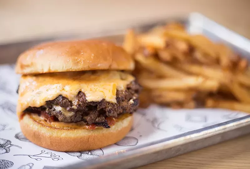 Double cheeseburger with fry sauce, tomato jam and American-cheddar pub cheese on an egg bun. - MABEL SUEN