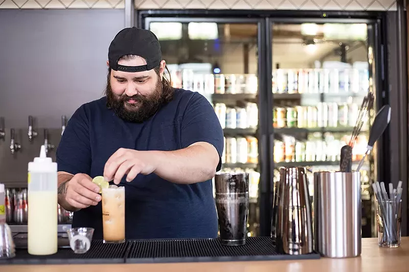 Tony Saputo behind the bar. - MABEL SUEN