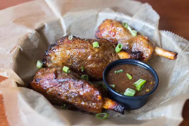 Pig Pops, small pork shanks, are braised until the meat is fall-off-the-bone tender. - MABEL SUEN