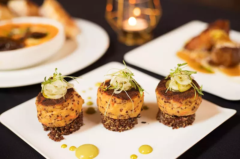 Appetizers and small plates include trout cakes, amazing pork belly and baked burrata. - MABEL SUEN